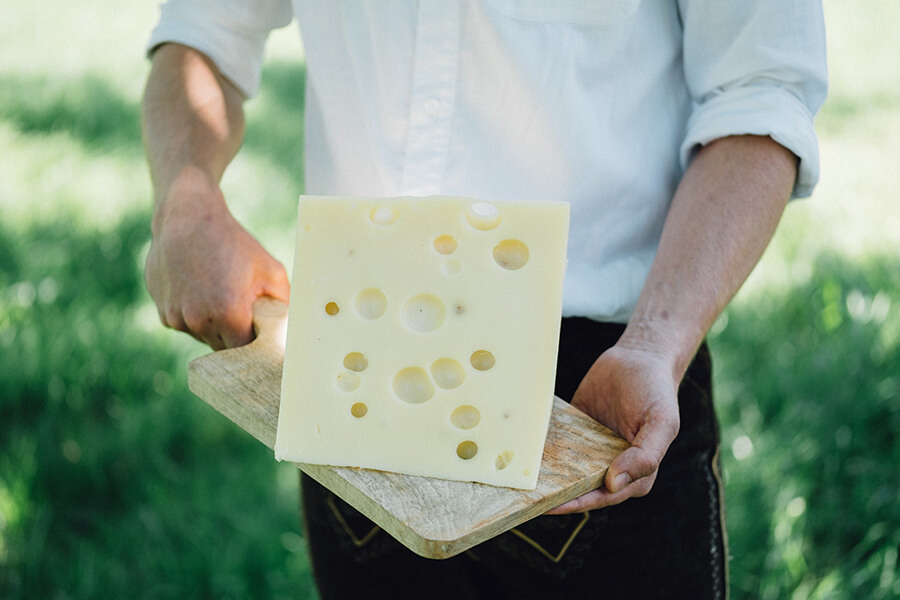 A piece of WOERLE cheese made from hay milk