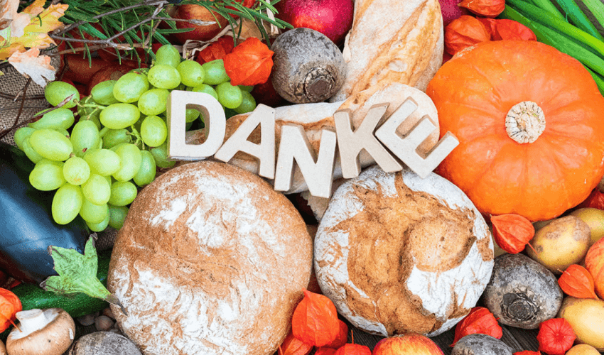 Thank you sign lying on food - Käserei Woerle